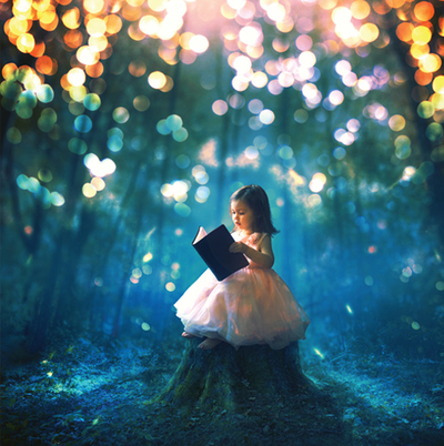 Little girl reading a book