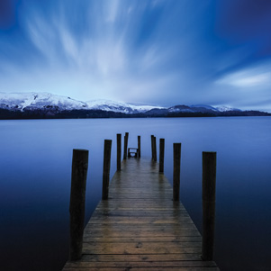 Winter landscape with a pier